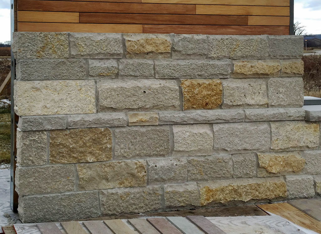 Buechel Stone masonry mock-up on construction site for veneer stone installation