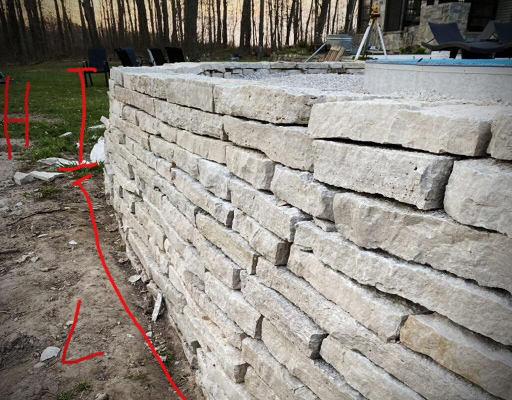 DIY retaining wall landscape How to build a dry stacked stone wall for outdoor climates - wall area ht x lngth